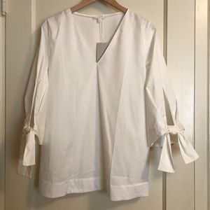White cotton v-necked popover top with tie sleeves